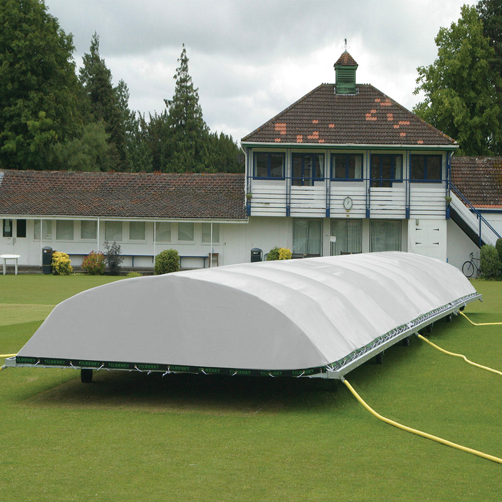 large raised cricket pitch cover on grass