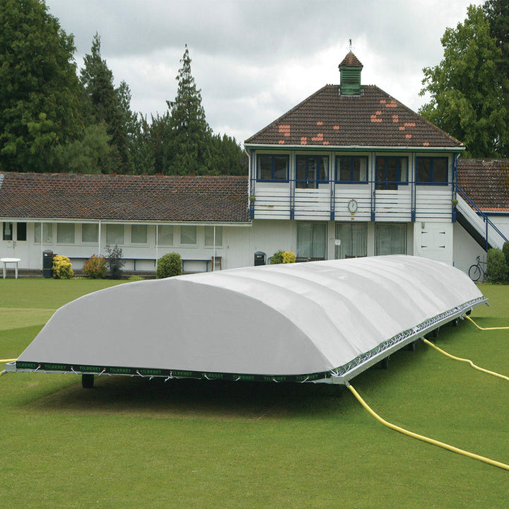 large raised cricket pitch cover on grass