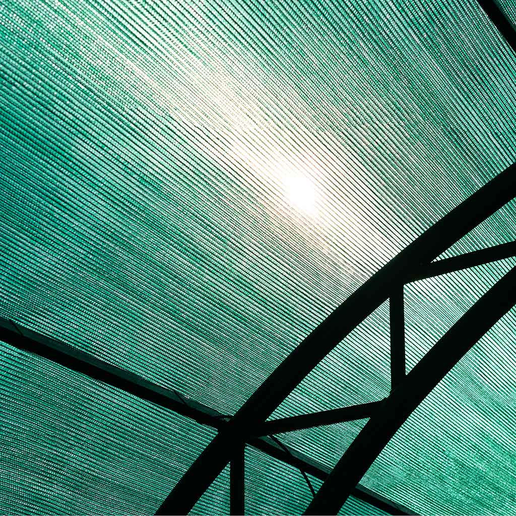 green netting over a metal arch structure