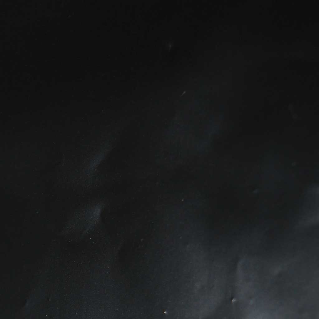 Dark textured surface with subtle variations
