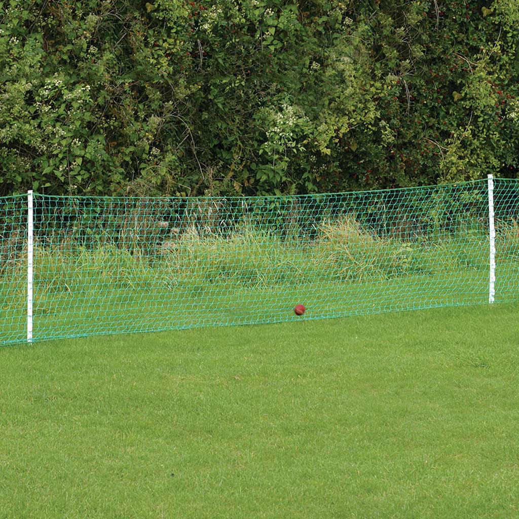 Cricket ball stop netting kit attached to the grass, with trees in the background