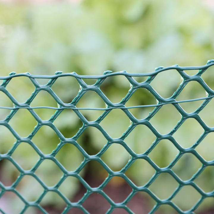 Closeup of green plastic border fencing 