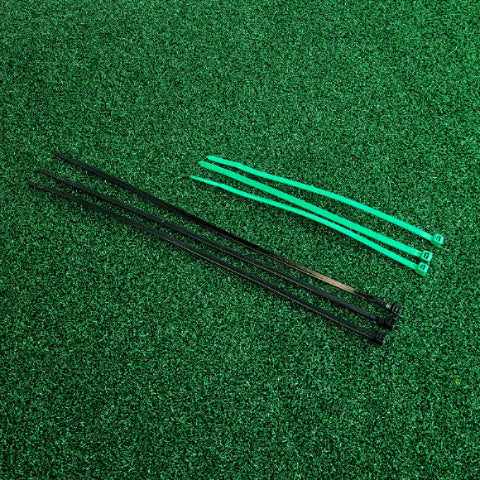 Black and green cable ties on astroturf