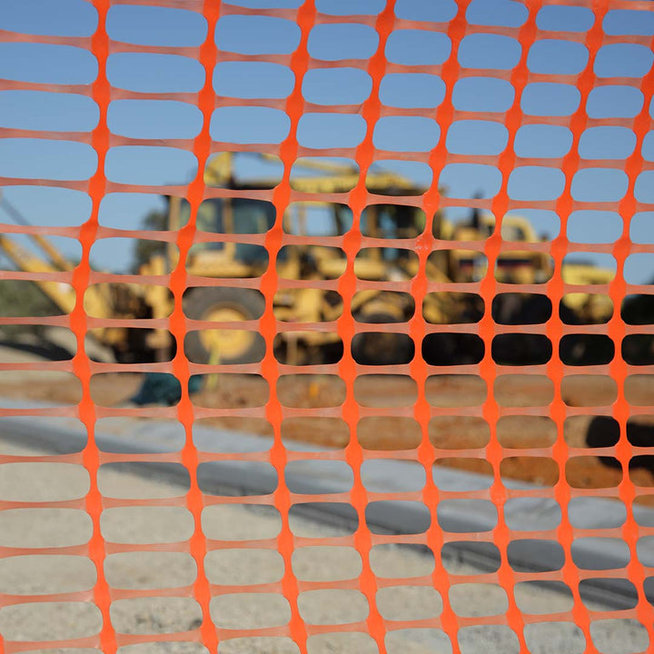 Close up view through orange barrier mesh on-site