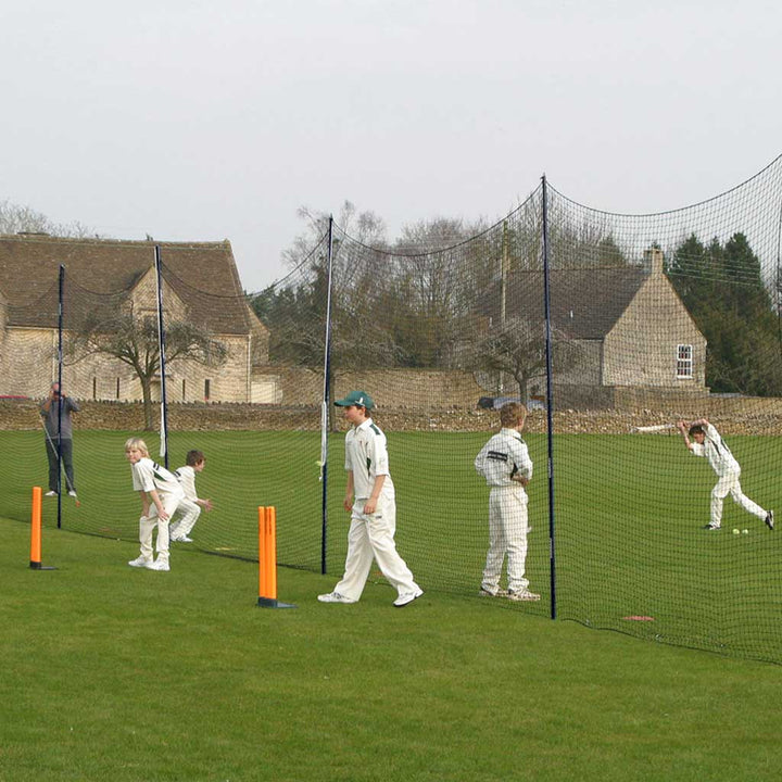 youth cricketers playing cricket with portanets in place