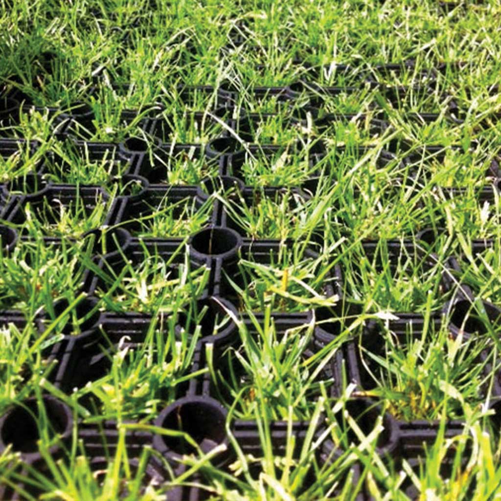 Rubber Grass Mat with grass growing through
