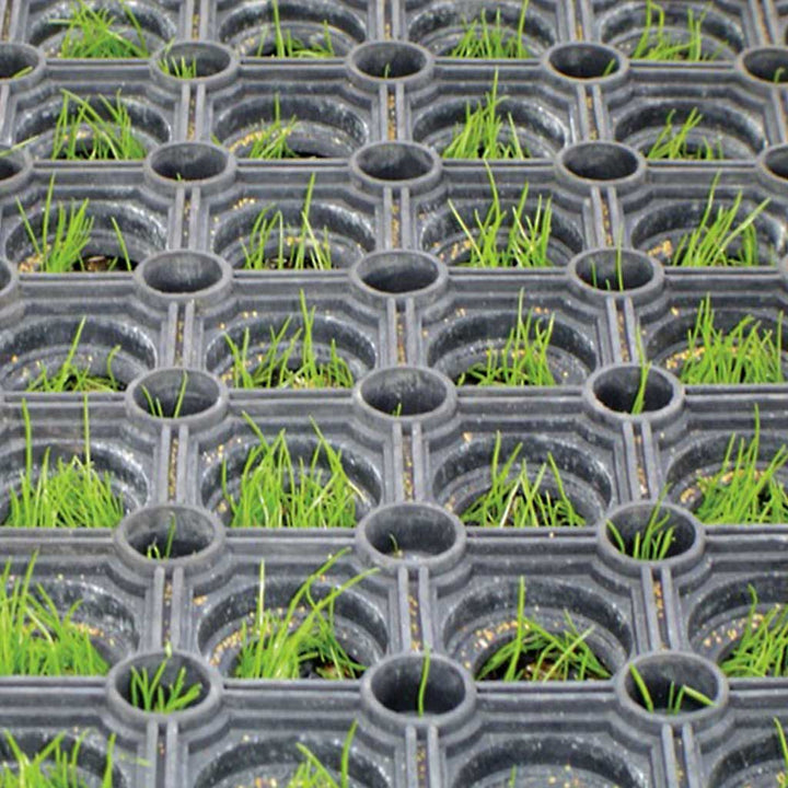 Rubber Grass Mat with grass growing through