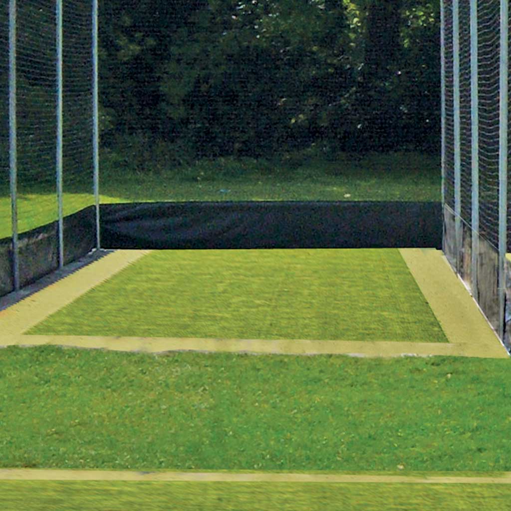 small cricket field area with net around it
